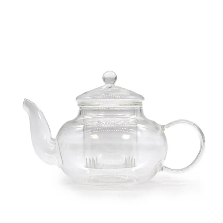 A clear glass teapot with a rounded body, a spout on the left, a curved handle on the right, and a lid with a round knob on top.