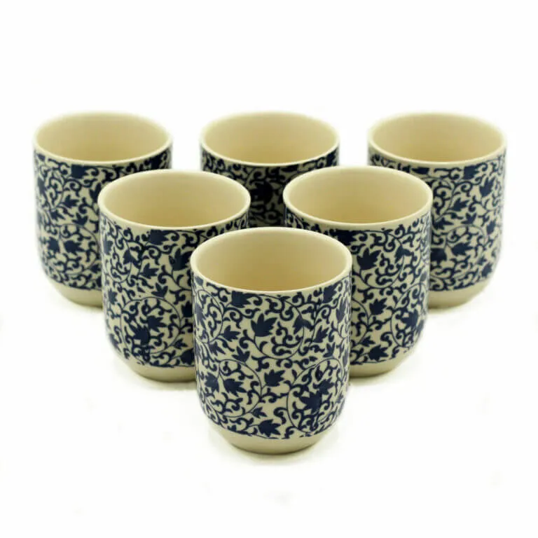 Six ceramic cups with blue and white intricate floral patterns are arranged in two rows on a plain white background.