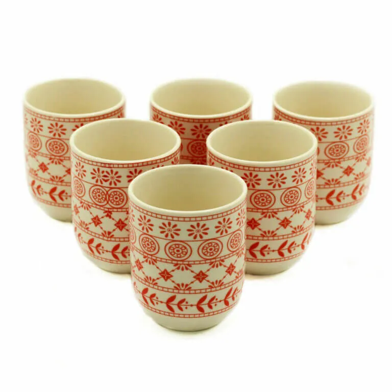 Six ceramic cups with red geometric and floral patterns arranged in two rows on a white background.