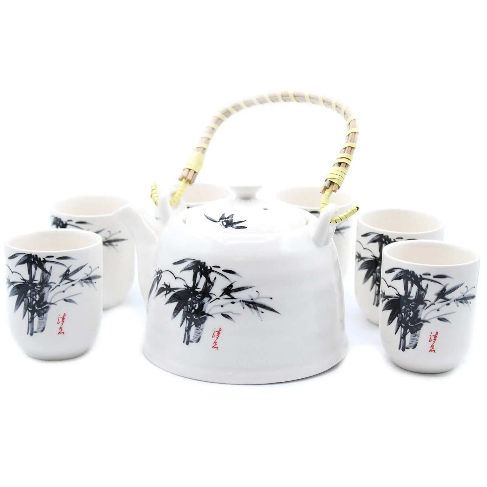 White ceramic teapot with a bamboo handle and four matching cups, all decorated with black bamboo designs and red Asian script.